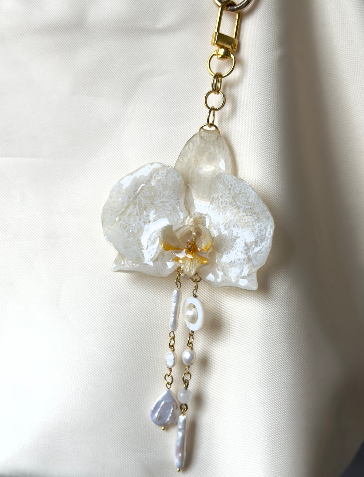 Lacy white orchid bag charm