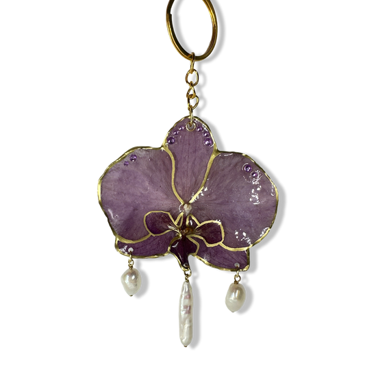 Purple pearly orchid bag charm